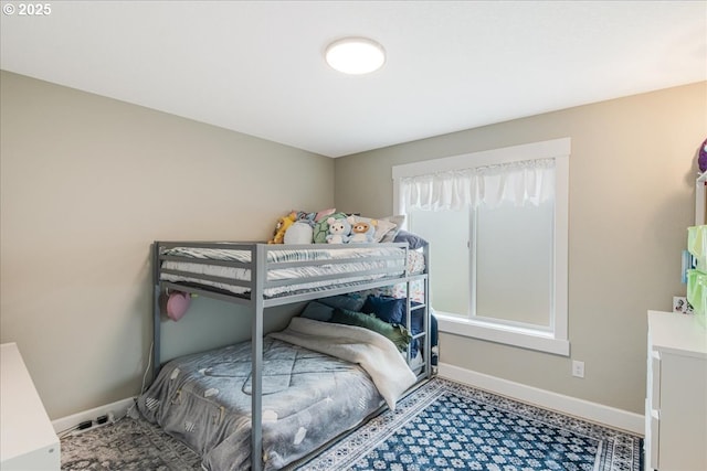 bedroom featuring baseboards