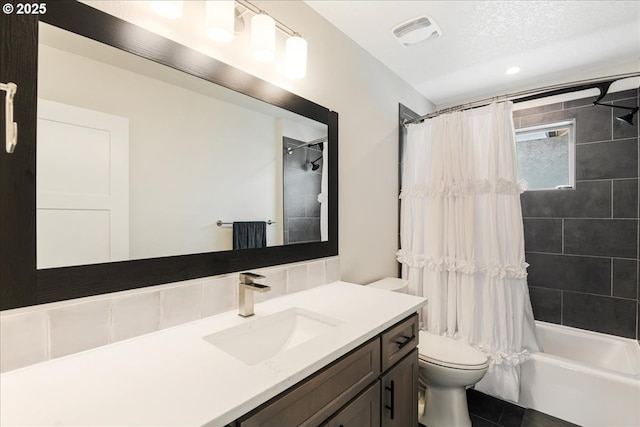 full bathroom with toilet, vanity, shower / tub combo with curtain, and tile patterned floors