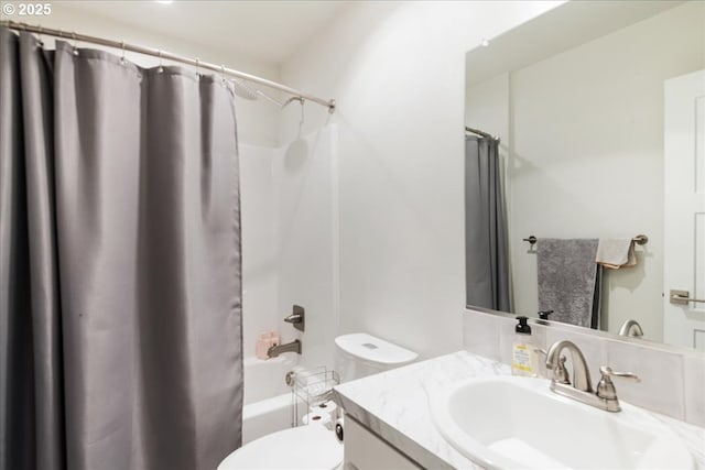 full bath with toilet, shower / bath combo, and vanity