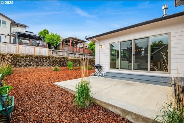 view of yard featuring fence and a patio