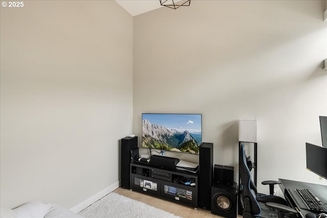 living room with light wood-style flooring and baseboards