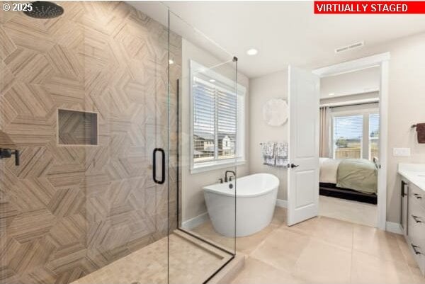 10494 SE Reverent Rd Unit 315, Happy Valley, OR 97086 - full bath with a freestanding bath, tile patterned flooring, vanity, ensuite bathroom, and a stall shower