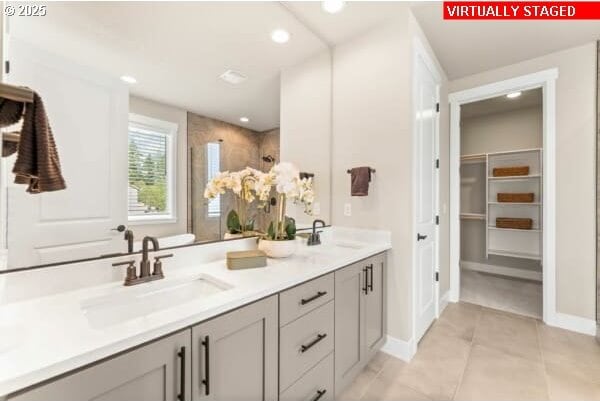 10494 SE Reverent Rd Unit 315, Happy Valley, OR 97086 - bathroom featuring tile patterned flooring, a sink, a tile shower, and double vanity