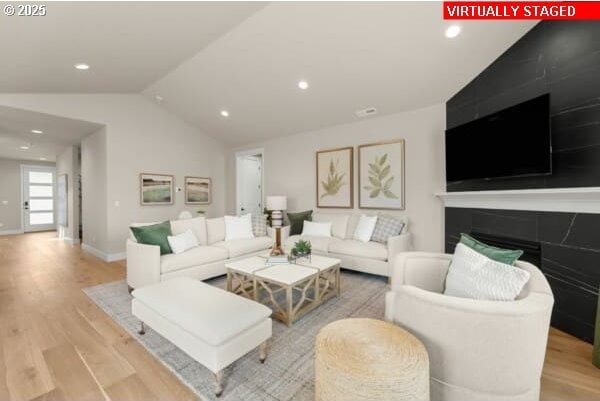 10494 SE Reverent Rd Unit 315, Happy Valley, OR 97086 - living room with baseboards, recessed lighting, lofted ceiling, and wood finished floors