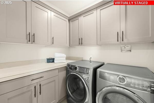 10494 SE Reverent Rd Unit 315, Happy Valley, OR 97086 - laundry area featuring washing machine and dryer and cabinet space