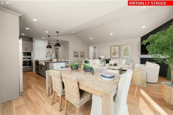 10494 SE Reverent Rd Unit 315, Happy Valley, OR 97086 - dining room featuring recessed lighting, vaulted ceiling, and light wood-style floors