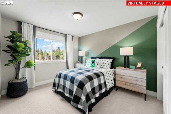 10494 SE Reverent Rd Unit 315, Happy Valley, OR 97086 - bedroom featuring light colored carpet, baseboards, and vaulted ceiling