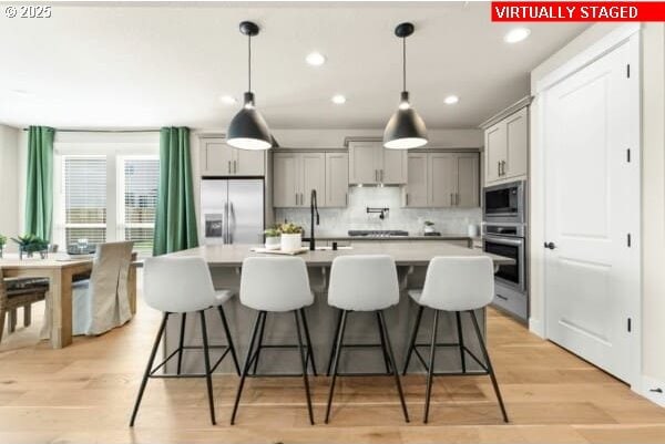 10494 SE Reverent Rd Unit 315, Happy Valley, OR 97086 - kitchen with light countertops, gray cabinets, and stainless steel appliances