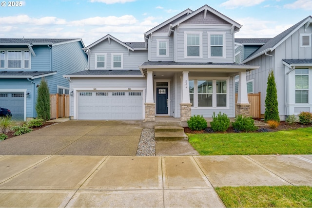 view of front of house featuring a front yard, a garage, and a porch