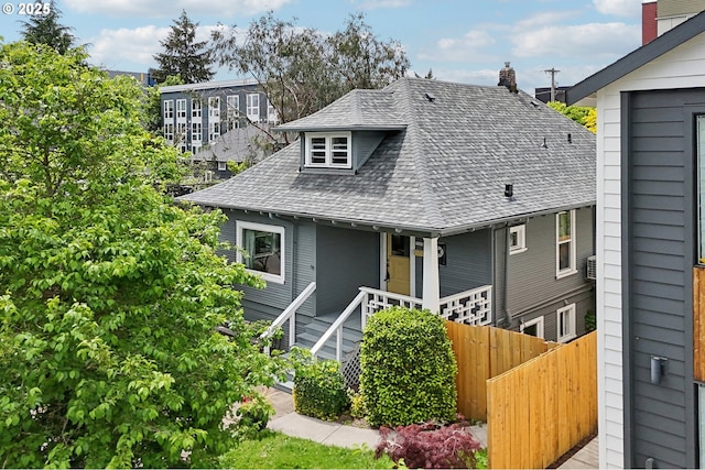 5205 N Maryland Ave, Portland, OR 97217 - view of front of property with roof with shingles, a chimney, and covered porch