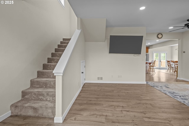 245 NE Balm St, Sheridan, OR 97378 - staircase featuring a ceiling fan, wood finished floors, french doors, baseboards, and recessed lighting