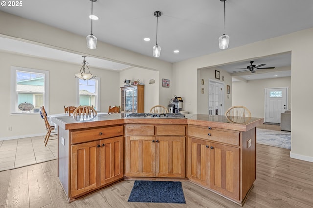 245 NE Balm St, Sheridan, OR 97378 - kitchen featuring stainless steel gas cooktop, light wood finished floors, open floor plan, plenty of natural light, and recessed lighting