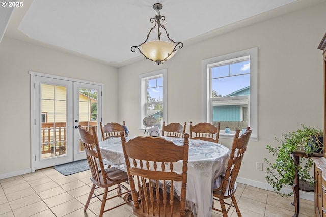 245 NE Balm St, Sheridan, OR 97378 - dining space with french doors, light tile patterned floors, and baseboards