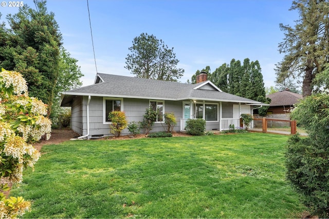 single story home with fence, a chimney, a shingled roof, and a front lawn