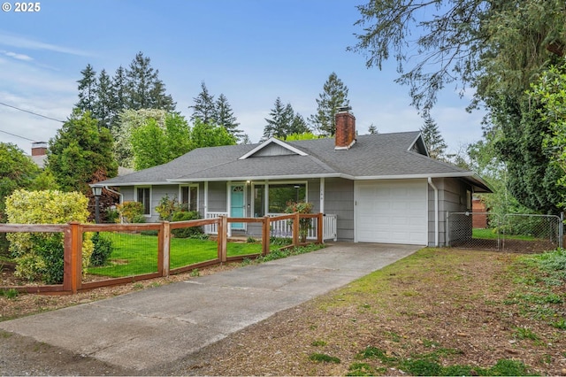 ranch-style home with a front yard, a chimney, concrete driveway, an attached garage, and a fenced front yard