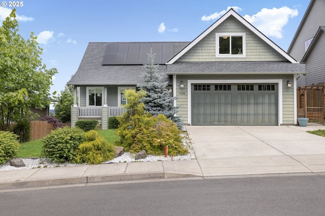 3678 Snowberry Rd, Eugene, OR 97403 - craftsman house with roof with shingles, roof mounted solar panels, concrete driveway, and an attached garage
