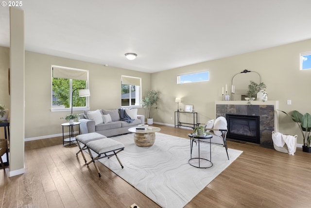 3678 Snowberry Rd, Eugene, OR 97403 - living area with a tile fireplace, wood finished floors, and baseboards