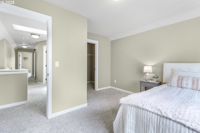 3678 Snowberry Rd, Eugene, OR 97403 - bedroom with carpet flooring, baseboards, a skylight, a spacious closet, and a closet