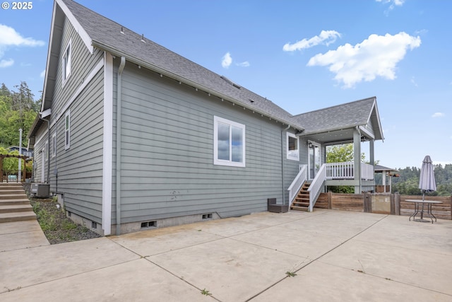 3678 Snowberry Rd, Eugene, OR 97403 - back of house with stairway, a patio, central AC unit, and roof with shingles