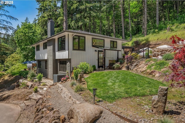 19919 SE Borges Rd, Damascus, OR 97089 - view of front of house with a chimney and a front lawn
