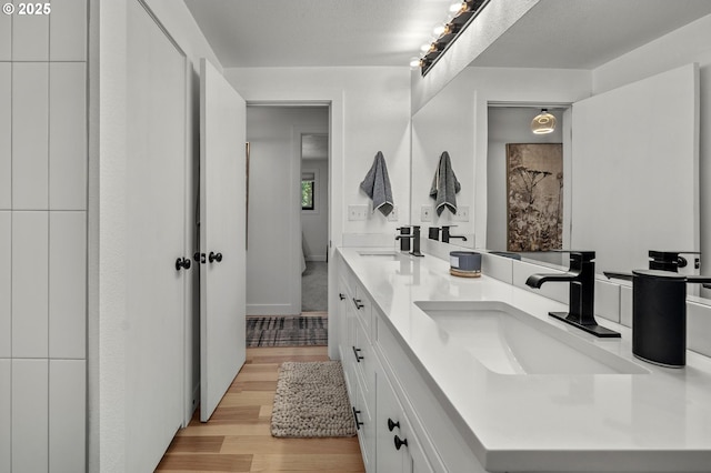 19919 SE Borges Rd, Damascus, OR 97089 - full bathroom with double vanity and wood finished floors