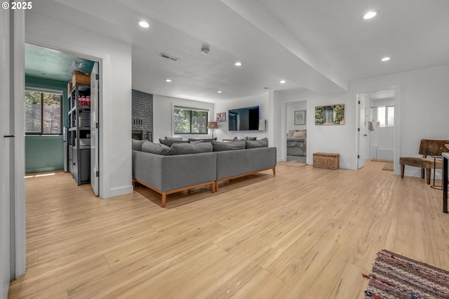 19919 SE Borges Rd, Damascus, OR 97089 - living area featuring light wood-style flooring, a brick fireplace, recessed lighting, and baseboards
