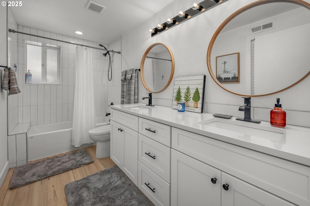 19919 SE Borges Rd, Damascus, OR 97089 - full bath featuring shower / bath combo, double vanity, toilet, wood finished floors, and recessed lighting