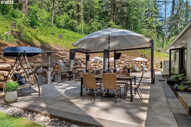 19919 SE Borges Rd, Damascus, OR 97089 - view of patio / terrace featuring outdoor dining space and a forest view