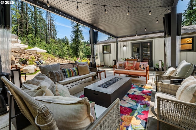 19919 SE Borges Rd, Damascus, OR 97089 - view of patio / terrace featuring french doors and an outdoor living space with a fire pit