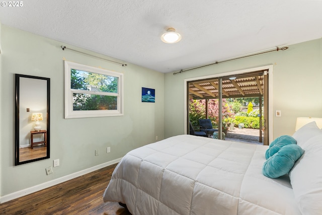 16511 NE Wasco St, Portland, OR 97230 - bedroom with access to outside, wood finished floors, and a textured ceiling