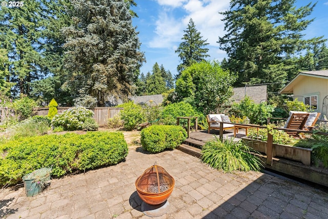 16511 NE Wasco St, Portland, OR 97230 - fenced backyard featuring an outdoor fire pit, a patio, and a deck