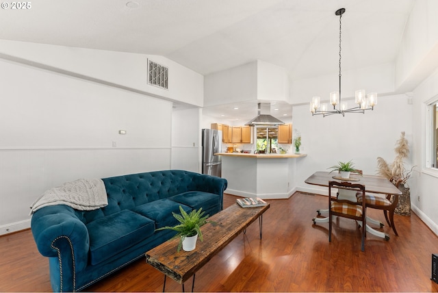 16511 NE Wasco St, Portland, OR 97230 - living room with a chandelier, lofted ceiling, and wood finished floors
