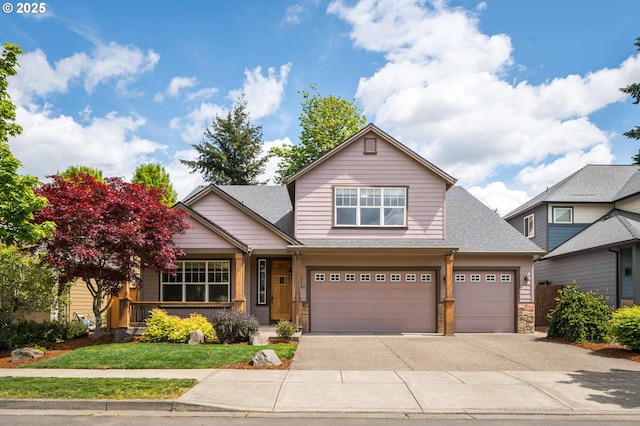 craftsman inspired home featuring an attached garage, a front yard, stone siding, a porch, and driveway