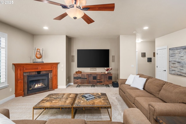 living room featuring recessed lighting, baseboards, ceiling fan, and light carpet