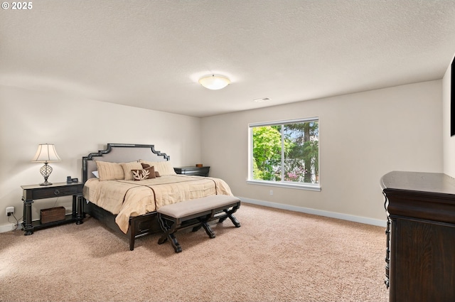 carpeted bedroom featuring baseboards