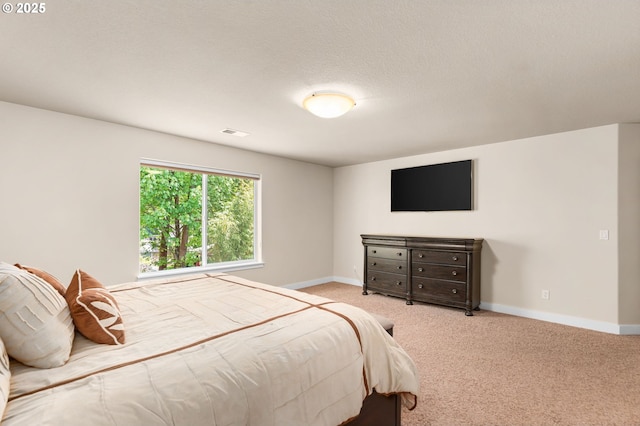 carpeted bedroom featuring baseboards