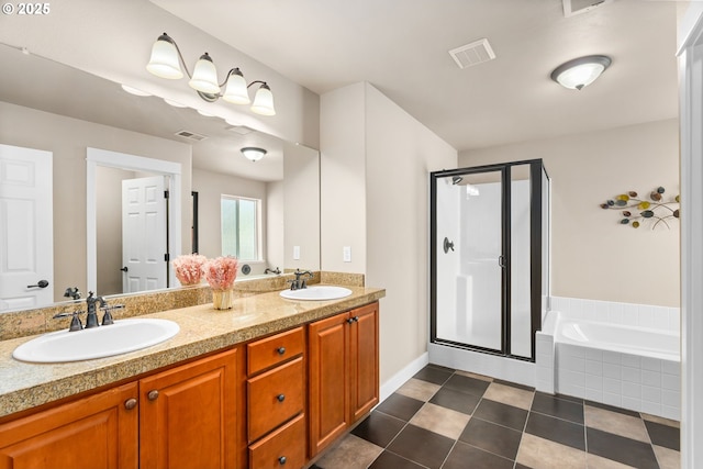 bathroom with visible vents, a shower stall, a sink, and a bath