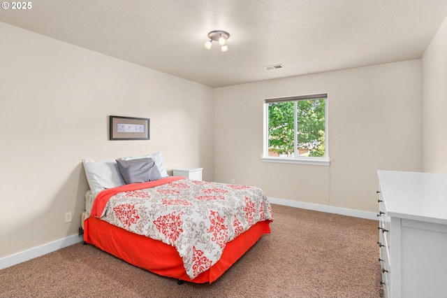 bedroom featuring visible vents, carpet, and baseboards