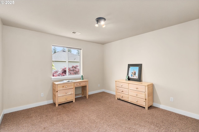 bedroom with baseboards, light carpet, and visible vents