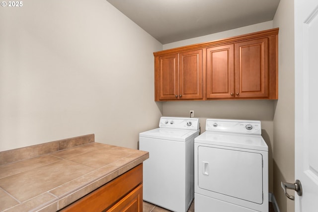 laundry area featuring cabinet space and washer and clothes dryer