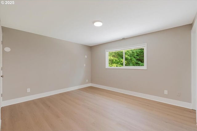 2706 SE Spruce St, Hillsboro, OR 97123 - spare room with light wood-style flooring and baseboards