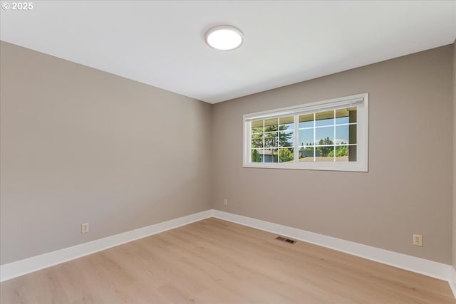 2706 SE Spruce St, Hillsboro, OR 97123 - spare room featuring light wood-style floors and baseboards