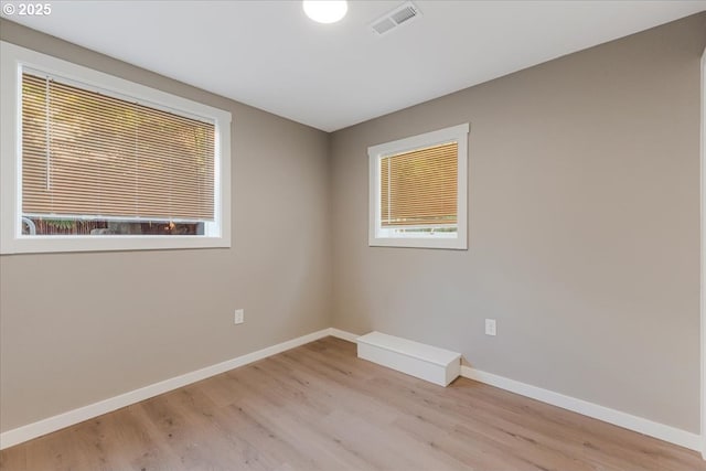 2706 SE Spruce St, Hillsboro, OR 97123 - spare room featuring light wood-style floors and baseboards