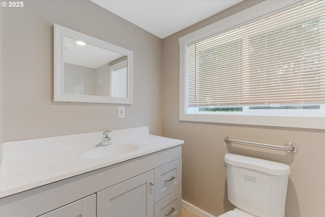 2706 SE Spruce St, Hillsboro, OR 97123 - bathroom featuring vanity, toilet, and baseboards
