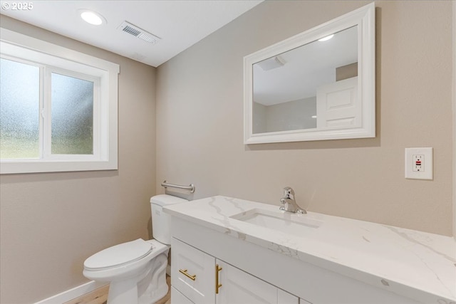 2706 SE Spruce St, Hillsboro, OR 97123 - bathroom with toilet, vanity, recessed lighting, and baseboards