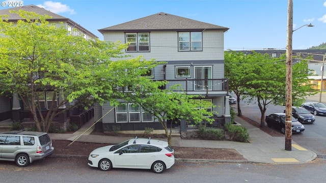 6708 N Pittsburg Ave, Portland, OR 97203 - view of front of home featuring a balcony and roof with shingles
