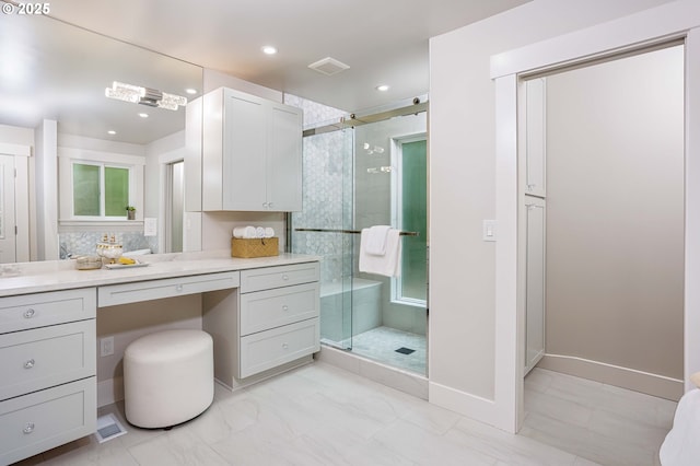 33500 E Bell Rd, Corbett, OR 97019 - bathroom featuring a stall shower, vanity, marble look tile flooring, and recessed lighting