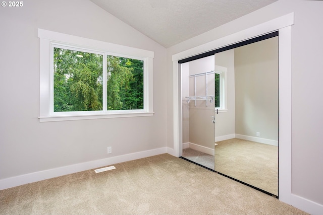 33500 E Bell Rd, Corbett, OR 97019 - unfurnished bedroom with carpet floors, a closet, and vaulted ceiling