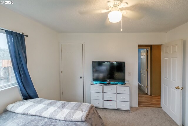 31501 Stoltz Hill Rd, Lebanon, OR 97355 - bedroom featuring light colored carpet, ceiling fan, and a textured ceiling