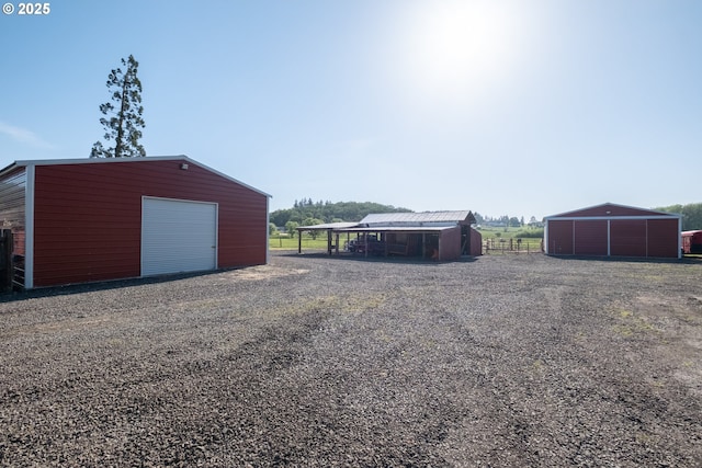 31501 Stoltz Hill Rd, Lebanon, OR 97355 - detached garage featuring fence and gravel driveway
